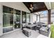 Inviting outdoor seating area with modern furniture and a view of the beautifully landscaped yard at 2561 Montego Bay Blvd, Kissimmee, FL 34746