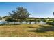 Expansive backyard with a white picket fence and views of the lake, great for outdoor enjoyment at 2703 Eagle Canyon S Dr, Kissimmee, FL 34746