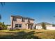 Spacious backyard with green grass and a shed, perfect for outdoor activities and relaxation at 2703 Eagle Canyon S Dr, Kissimmee, FL 34746