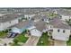 Overview of a well-planned community featuring modern homes, driveways, and manicured lawns at 2838 Common Crane Ct, Harmony, FL 34773