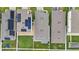 Overhead view of homes equipped with solar panels, highlighting community design and landscaping at 2838 Common Crane Ct, Harmony, FL 34773