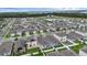 An elevated view of a house in a well-planned community with water features and green spaces in the distance at 2838 Common Crane Ct, Harmony, FL 34773