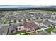 An aerial view of a house with a fenced backyard, highlighting a well-planned community with nearby lakes and green spaces at 2838 Common Crane Ct, Harmony, FL 34773