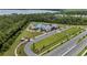 An aerial shot captures the community's resort-style pool and amenity center with wooded views at 2838 Common Crane Ct, Harmony, FL 34773