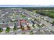An aerial perspective showcasing a home's location in a neighborhood, highlighting the proximity to local roads and community features at 2838 Common Crane Ct, Harmony, FL 34773