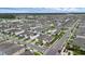 An aerial shot displays the community, showcasing the overall layout and landscaping at 2838 Common Crane Ct, Harmony, FL 34773