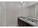 Bathroom featuring double vanity with granite countertops and stainless steel faucets at 2838 Common Crane Ct, Harmony, FL 34773