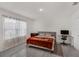 Bedroom featuring lots of natural light, wood-look flooring, and neutral walls at 2838 Common Crane Ct, Harmony, FL 34773