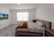 Bedroom with hardwood flooring, large window and a queen-sized bed at 2838 Common Crane Ct, Harmony, FL 34773