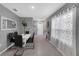 Modern dining room with neutral walls, tile flooring, and a stylish table set at 2838 Common Crane Ct, Harmony, FL 34773