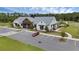 A modern community center exterior with ample parking and landscaped grounds for community events and gatherings at 2838 Common Crane Ct, Harmony, FL 34773