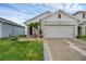 Home with a well-manicured lawn and attractive landscaping at 2838 Common Crane Ct, Harmony, FL 34773