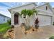 Beautifully landscaped front yard and two-car garage at 2838 Common Crane Ct, Harmony, FL 34773