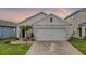 Charming single-story home with a well-maintained lawn and two-car garage at 2838 Common Crane Ct, Harmony, FL 34773