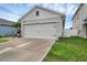 View of the exterior of the attached two-car garage at 2838 Common Crane Ct, Harmony, FL 34773