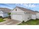View of the exterior of the attached two-car garage at 2838 Common Crane Ct, Harmony, FL 34773