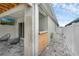 Relaxing outdoor lanai featuring hardscape flooring, a TV, and two lounge chairs at 2838 Common Crane Ct, Harmony, FL 34773