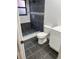 Modern bathroom featuring a tiled walk-in shower, toilet, and vanity at 2900 S Semoran Blvd # 1, Orlando, FL 32822