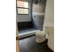 Modern bathroom featuring a tiled walk-in shower, toilet, and vanity at 2900 S Semoran Blvd # 1, Orlando, FL 32822