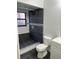 Modern bathroom featuring dark gray tile and a walk-in shower with stylish mosaic accents at 2900 S Semoran Blvd # 1, Orlando, FL 32822