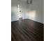 Bedroom with new dark wood-look flooring and modern lighting at 2900 S Semoran Blvd # 1, Orlando, FL 32822
