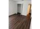 Bedroom featuring closet and dark laminate flooring at 2900 S Semoran Blvd # 1, Orlando, FL 32822
