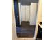 Hallway with a closet and newer wood floors at 2900 S Semoran Blvd # 1, Orlando, FL 32822
