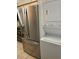 Stainless steel refrigerator and stacked washer/dryer at 2900 S Semoran Blvd # 1, Orlando, FL 32822