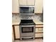 Close-up of the stainless steel range and microwave at 2900 S Semoran Blvd # 1, Orlando, FL 32822