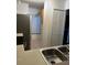 Open kitchen with a view of the tile-floored dining area at 2900 S Semoran Blvd # 1, Orlando, FL 32822