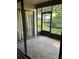 Screened patio with tile floors and view to the backyard at 2900 S Semoran Blvd # 1, Orlando, FL 32822