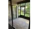 Enclosed back porch featuring glass windows and tile flooring at 2900 S Semoran Blvd # 1, Orlando, FL 32822