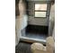 Bathroom featuring gray and white tiling in the shower, with mosaic tile accents at 2900 S Semoran Blvd # 1, Orlando, FL 32822