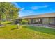 A well-maintained backyard featuring green grass, a privacy fence, and lush vegetation at 2907 Prince Oak Ct, St Cloud, FL 34769