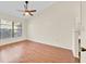 Empty bedroom featuring laminate wood flooring and a window offering natural light at 2907 Prince Oak Ct, St Cloud, FL 34769