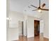 Hallway with laminate flooring leading to the bedroom and bathroom at 2907 Prince Oak Ct, St Cloud, FL 34769