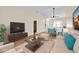 Virtually staged living room with nice seating, decor and an open concept at 2907 Prince Oak Ct, St Cloud, FL 34769