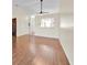 Spacious living room featuring laminate floors and an open view to the kitchen at 2907 Prince Oak Ct, St Cloud, FL 34769