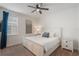 This bedroom is equipped with a ceiling fan and plush carpet at 331 Pendant Ct, Kissimmee, FL 34747