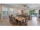 Cozy dining and living area with ample natural light and sliding glass doors opening to the outdoor pool at 331 Pendant Ct, Kissimmee, FL 34747