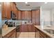 Spacious kitchen with stainless steel appliances, granite countertops, ample cabinet space, and tile flooring at 331 Pendant Ct, Kissimmee, FL 34747