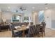 Inviting living and dining area with neutral decor, ceiling fans, and sliding door access to the backyard at 331 Pendant Ct, Kissimmee, FL 34747