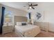 Serene main bedroom with soft lighting, a ceiling fan, and neutral decor for a relaxing retreat at 331 Pendant Ct, Kissimmee, FL 34747