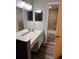 Bathroom with vanity, two mirrors, and a shower and tub combo at 4341 Aqua Vista Dr # A, Orlando, FL 32839