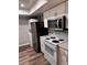 Updated kitchen features white cabinets, black appliances, and a bright, modern look at 4341 Aqua Vista Dr # A, Orlando, FL 32839