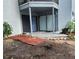 A patio with sliding glass doors and a partially bricked space outdoors at 4341 Aqua Vista Dr # A, Orlando, FL 32839