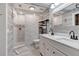 Modern bathroom with walk-in shower, dual sinks, marble countertops, and stylish gray and white tile at 4410 Mildred Bass Rd, St Cloud, FL 34772