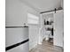 A clean bathroom features white beadboard walls, a modern toilet, and a privacy door at 4410 Mildred Bass Rd, St Cloud, FL 34772