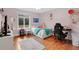 Cozy pink bedroom with a bed, desk, and a window overlooking nature, perfect for a teenager at 4410 Mildred Bass Rd, St Cloud, FL 34772