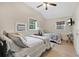 This light-filled bedroom includes a vaulted ceiling, wood floors and two comfortable beds at 4410 Mildred Bass Rd, St Cloud, FL 34772